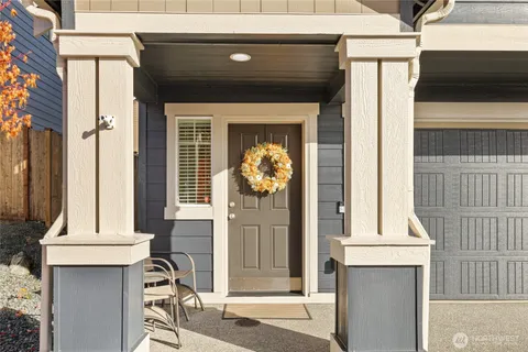 a front view of a house with large windows