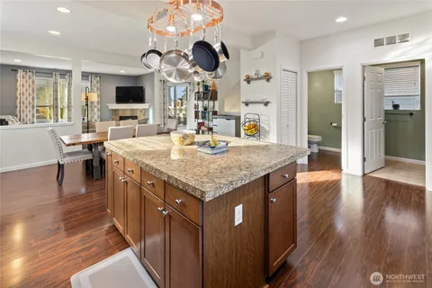 an open kitchen with a table and chairs in it