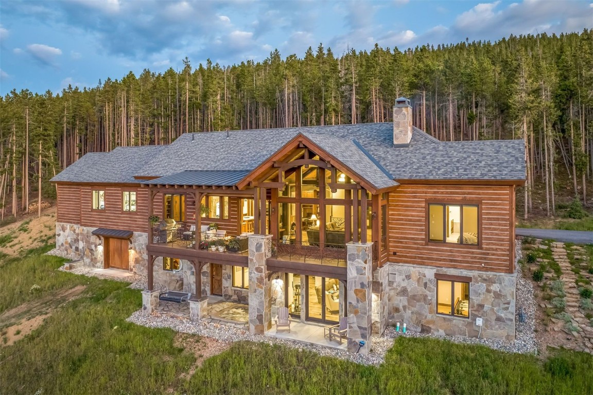 a view of a house with a yard and furniture