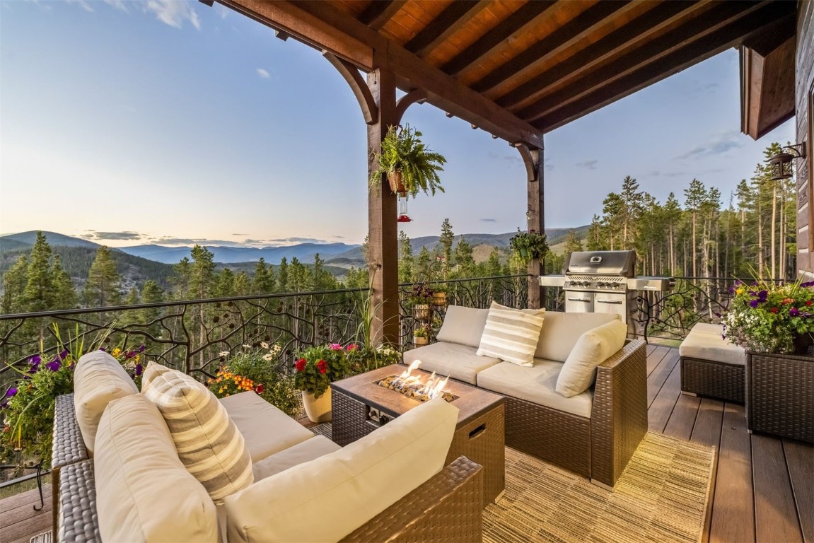 242 Point View Place Breckenridge, CO 80424 - Photo 13 of 47 a view of balcony with couches and potted plants