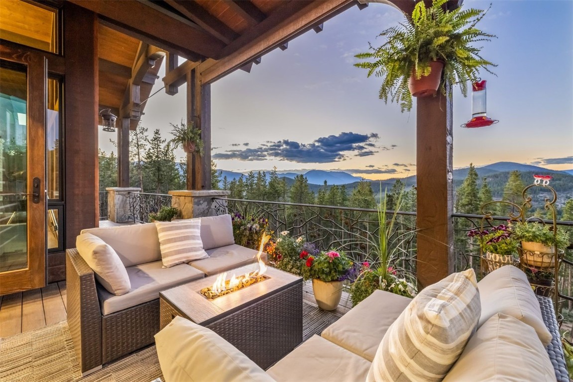 242 Point View Place Breckenridge, CO 80424 - Photo 14 of 47 a view of a balcony with couches and potted plants