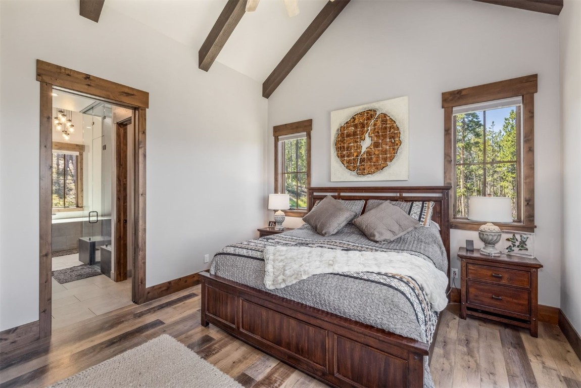 242 Point View Place Breckenridge, CO 80424 - Photo 15 of 47 a bedroom with a bed and wooden floor