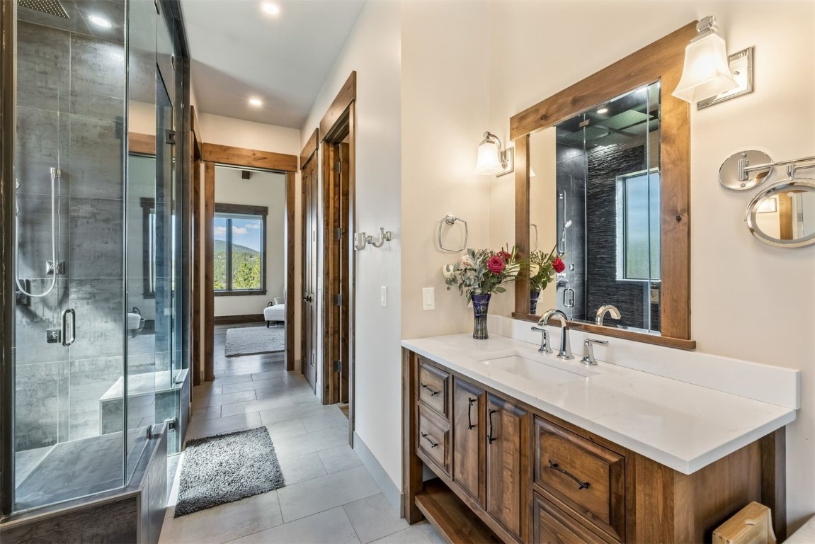 242 Point View Place Breckenridge, CO 80424 - Photo 16 of 47 a bathroom with a double vanity sink mirror and shower