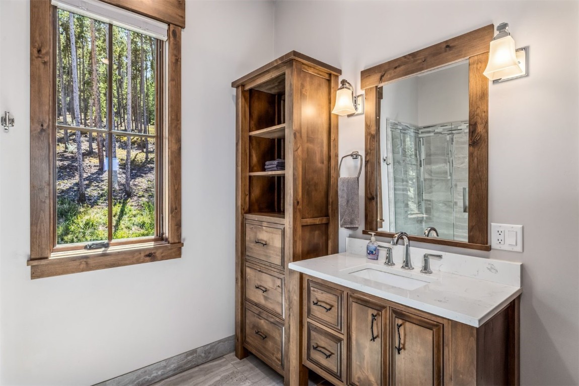 242 Point View Place Breckenridge, CO 80424 - Photo 22 of 47 a bathroom with a sink and a mirror