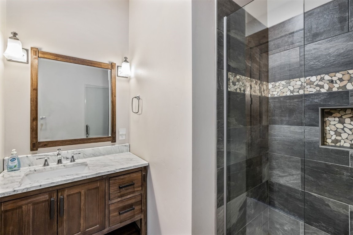242 Point View Place Breckenridge, CO 80424 - Photo 30 of 47 a bathroom with a shower sink and mirror
