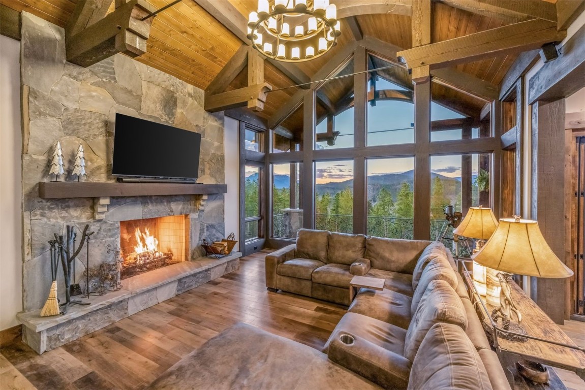 242 Point View Place Breckenridge, CO 80424 - Photo 3 of 47 a living room with furniture a flat screen tv and a fireplace