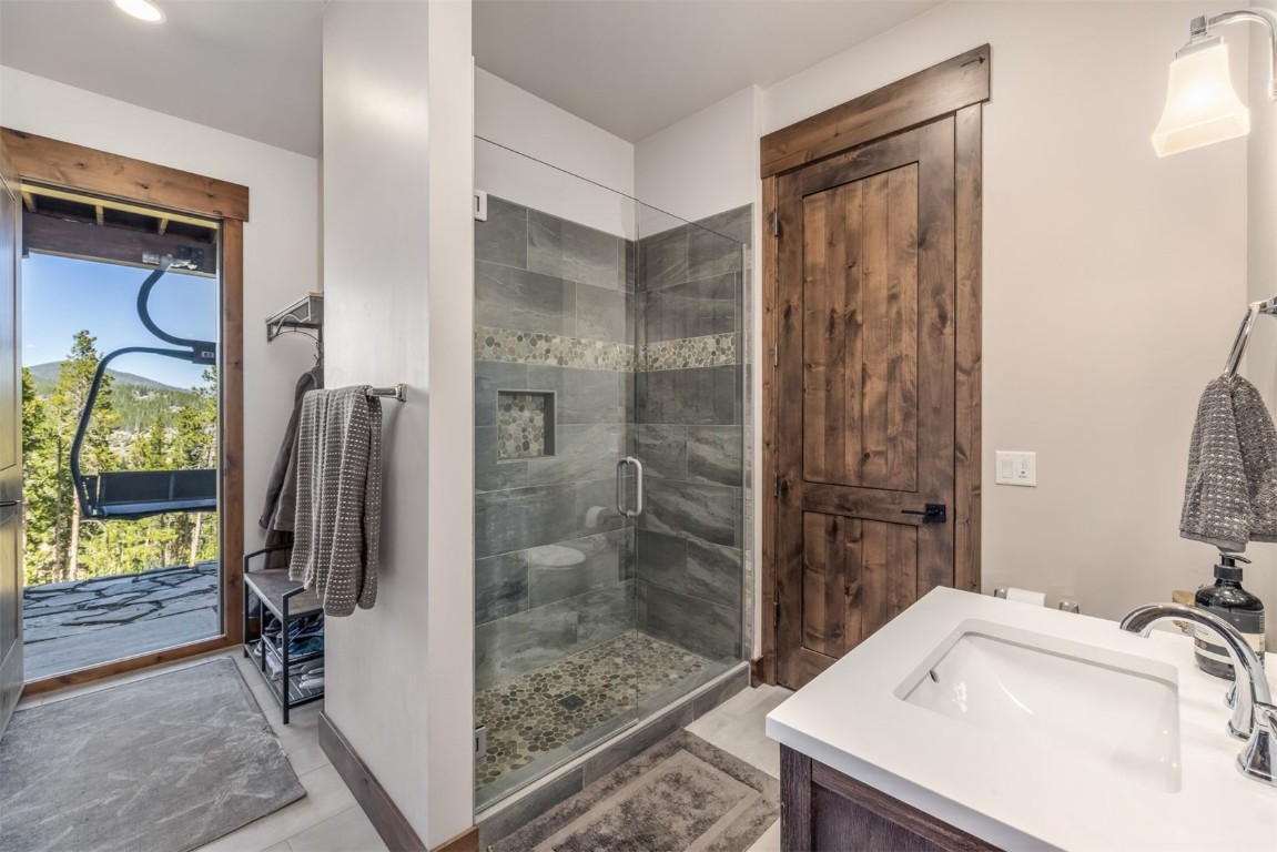 242 Point View Place Breckenridge, CO 80424 - Photo 32 of 47 a bathroom with a sink and a mirror