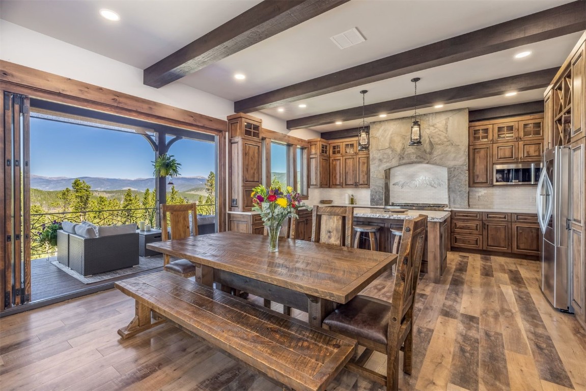242 Point View Place Breckenridge, CO 80424 - Photo 9 of 47 a view of a dining room with furniture window and wooden floor