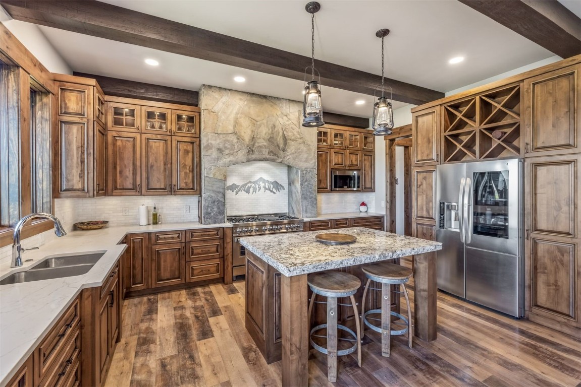 242 Point View Place Breckenridge, CO 80424 - Photo 10 of 47 a kitchen with stainless steel appliances granite countertop a sink stove and refrigerator