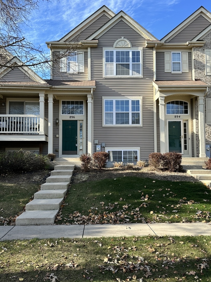 896 Emerald Drive Pingree Grove, IL 60140 - Photo 2 of 19 a front view of a house with garden
