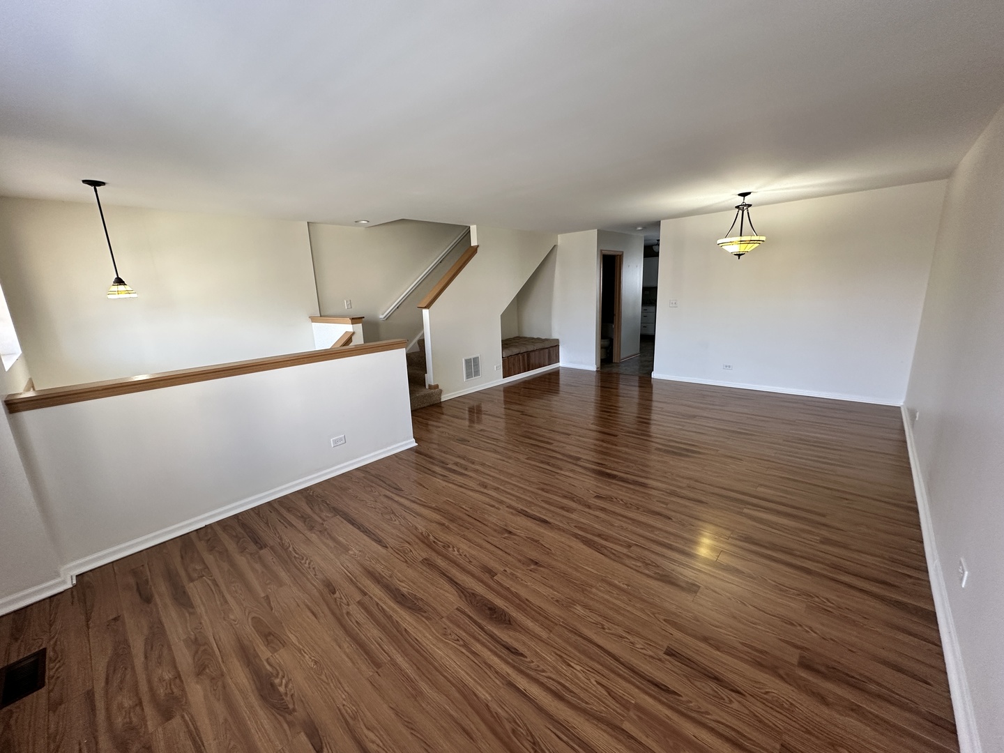 896 Emerald Drive Pingree Grove, IL 60140 - Photo 5 of 19 a view of an empty room with wooden floor and a window