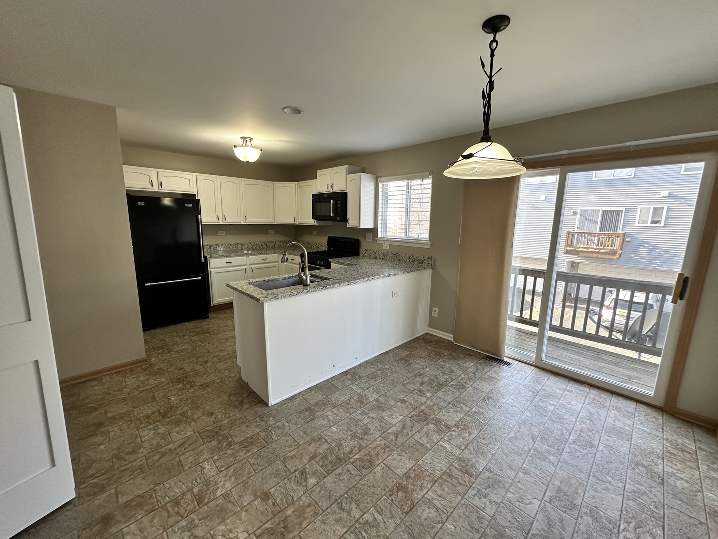 896 Emerald Drive Pingree Grove, IL 60140 - Photo 7 of 19 a view of a kitchen with a sink
