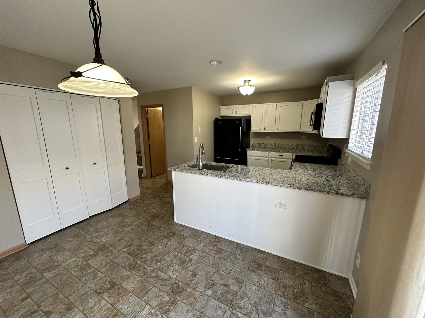 896 Emerald Drive Pingree Grove, IL 60140 - Photo 9 of 19 a view of a kitchen with microwave and cabinets