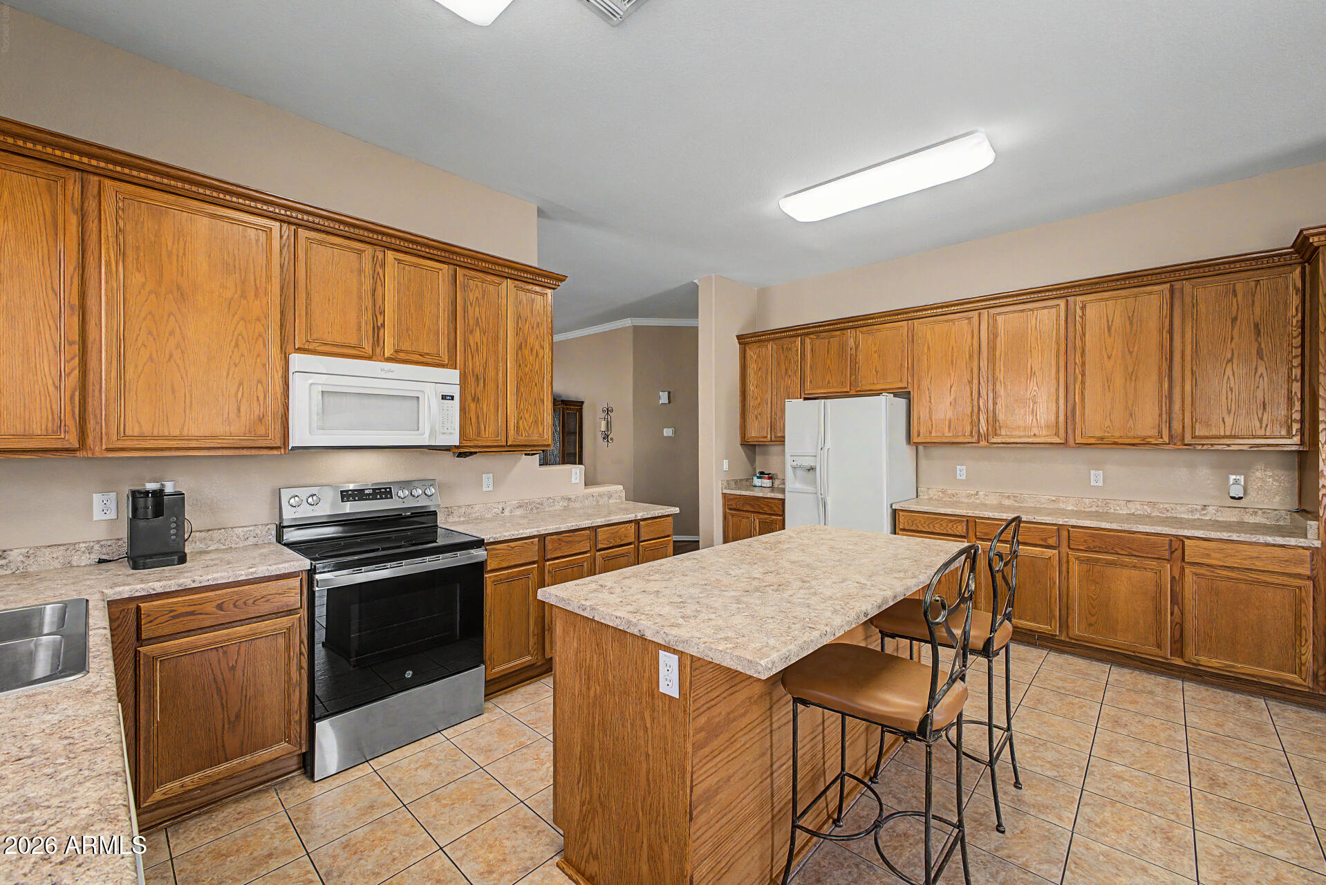 4394 South Strong Box Road Gold Canyon, AZ 85118 - Photo 15 of 33 a kitchen with stainless steel appliances granite countertop a stove a sink dishwasher and a refrigerator