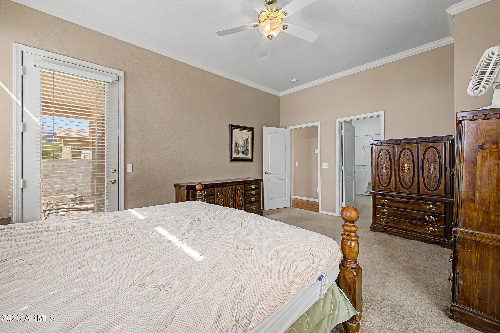 4394 South Strong Box Road Gold Canyon, AZ 85118 - Photo 17 of 33 a bedroom with a bed and wooden floor