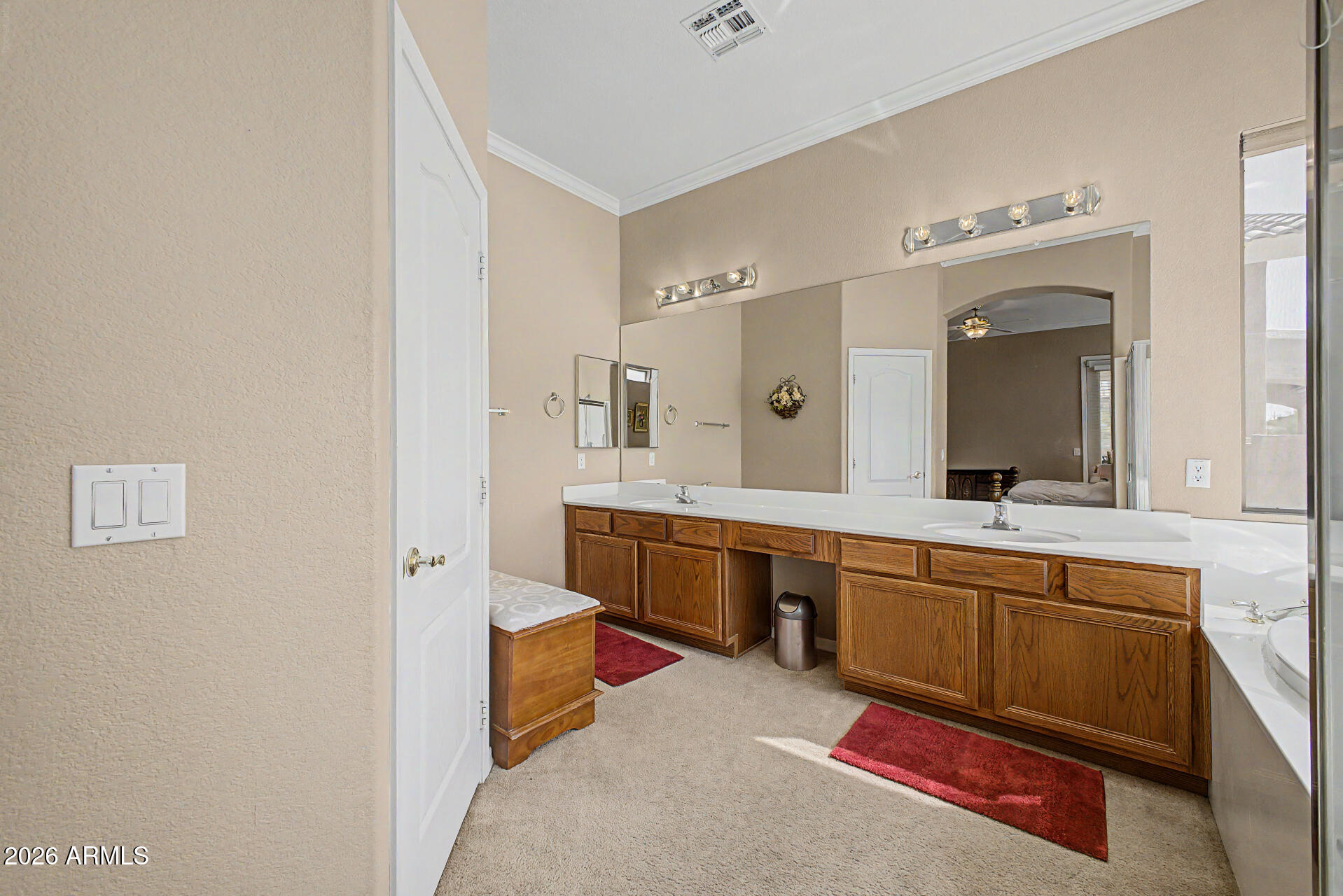 4394 South Strong Box Road Gold Canyon, AZ 85118 - Photo 18 of 33 a large bathroom with a double vanity sink and a mirror