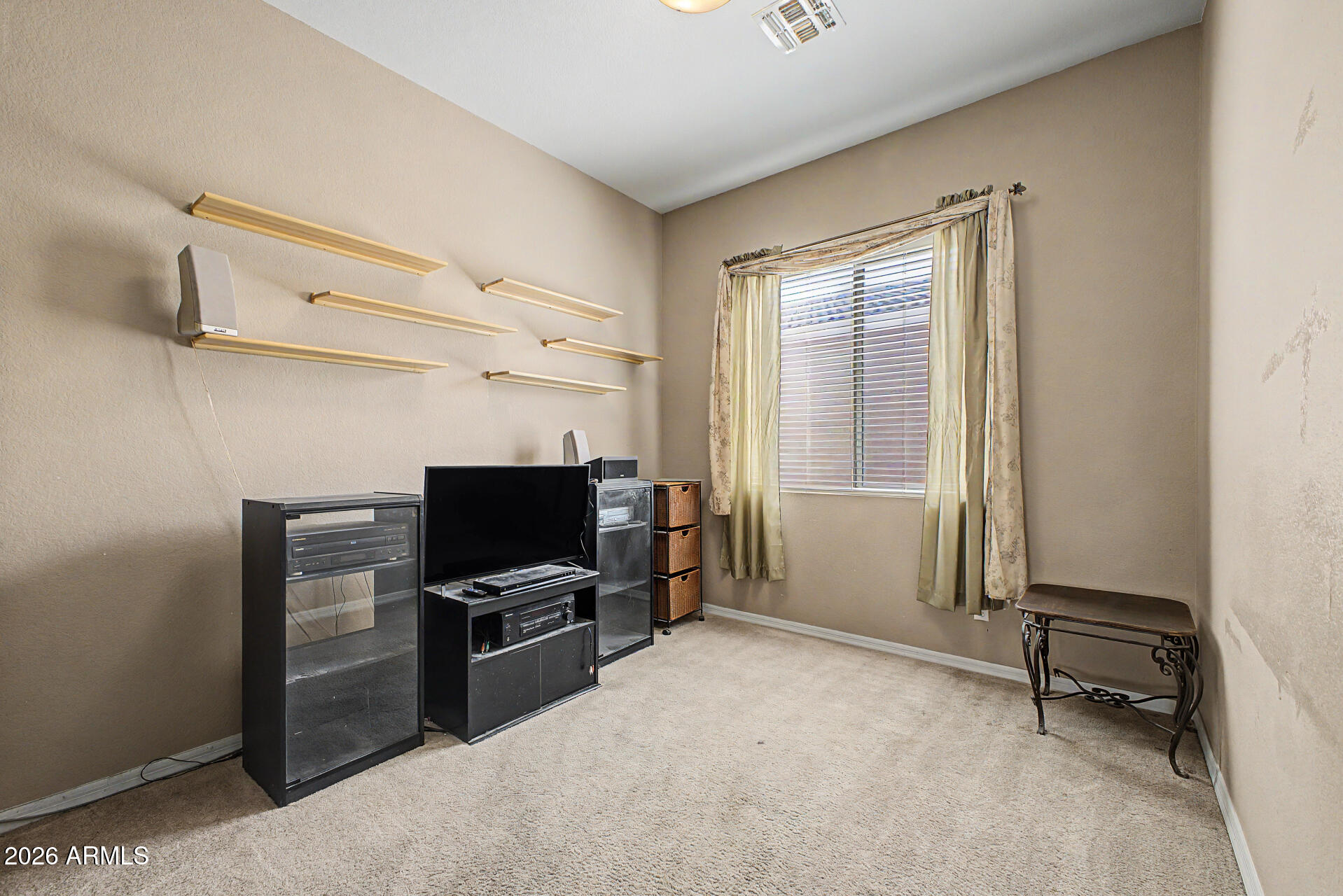 4394 South Strong Box Road Gold Canyon, AZ 85118 - Photo 25 of 33 a room with furniture and a flat screen tv