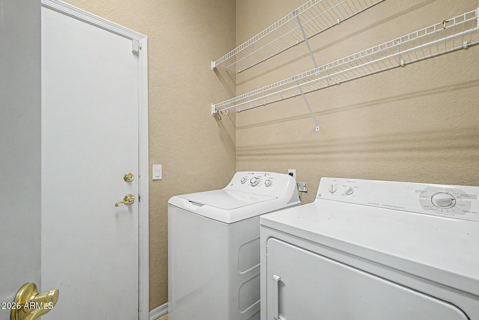 4394 South Strong Box Road Gold Canyon, AZ 85118 - Photo 28 of 33 a utility room with dryer and washer