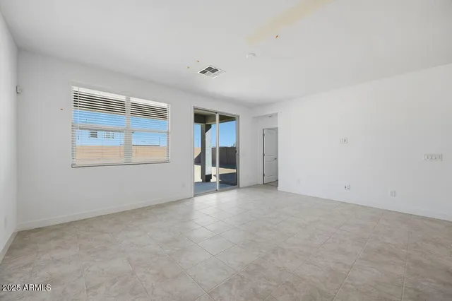 a view of empty room with windows