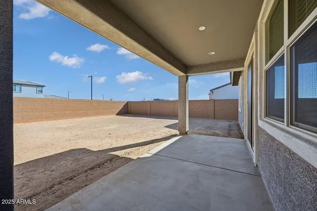 an aerial view of a house with a swimming pool
