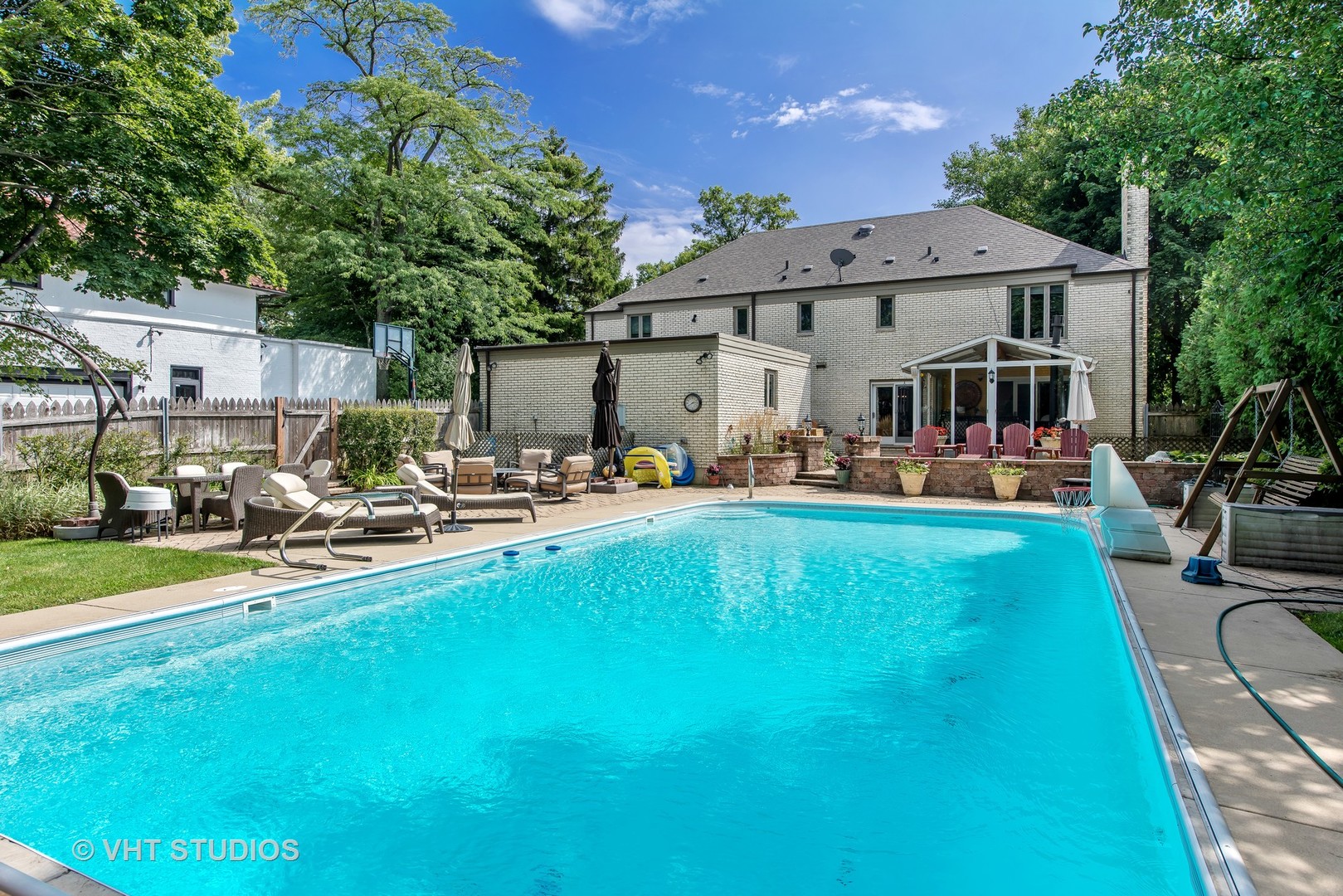 235 Maple Hill Road Glencoe, IL 60022 - Photo 28 of 35 a front view of a house with swimming pool garden and patio