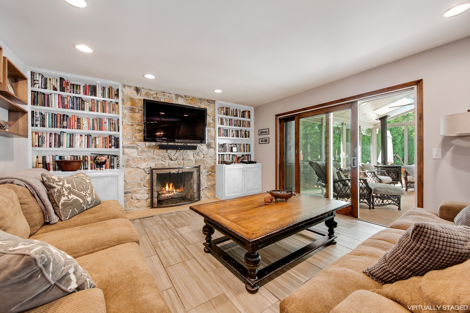 235 Maple Hill Road Glencoe, IL 60022 - Photo 4 of 35 a living room with furniture a flat screen tv and a fireplace