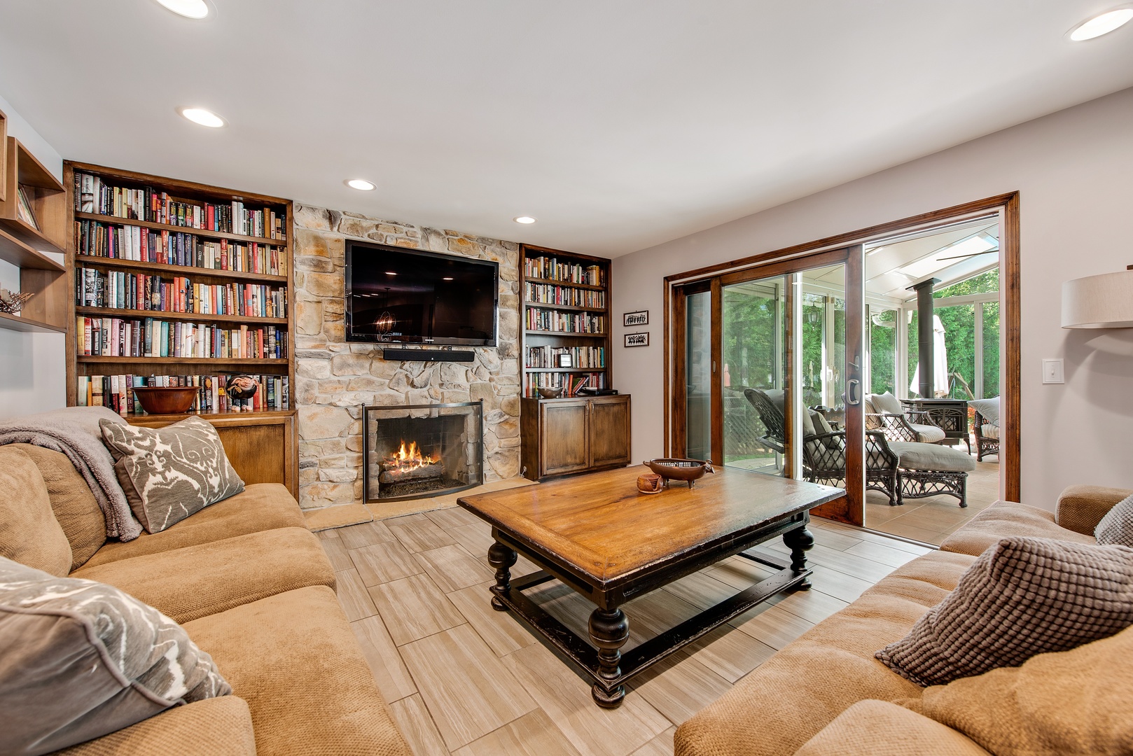 235 Maple Hill Road Glencoe, IL 60022 - Photo 5 of 35 a living room with furniture flat screen tv and a fireplace