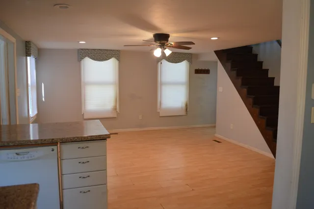 a view of room with window and cabinet