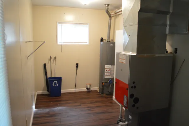 a view of an entryway with wooden floor
