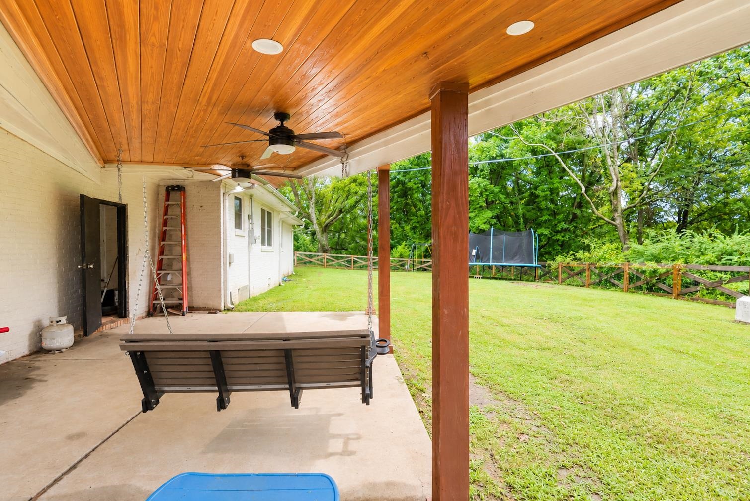 10093 Mt Carmel Road Brighton, TN 38011 - Photo 6 of 36 Covered patio featuring a wood-finish ceiling, dual ceiling fans, and concrete flooring