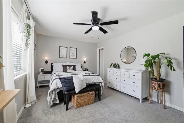 a bed room with a bed and a dresser