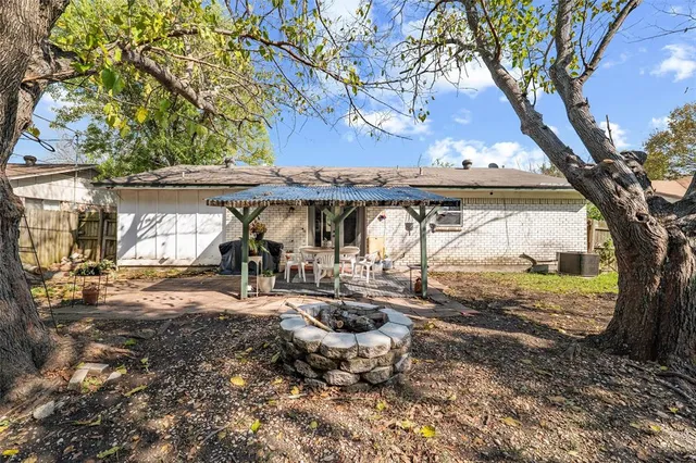 a view of a car park in front of a house
