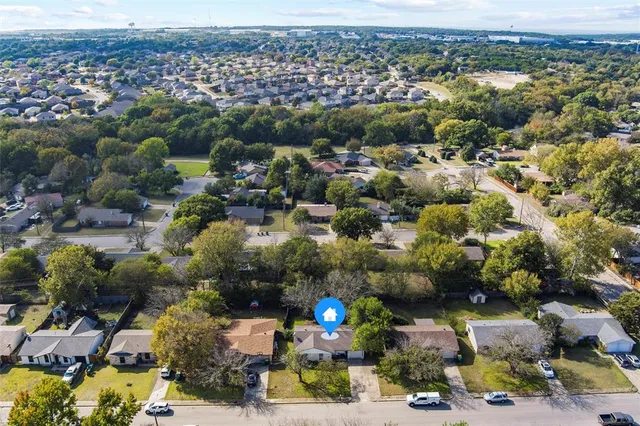 an aerial view of a city with lots of residential buildings