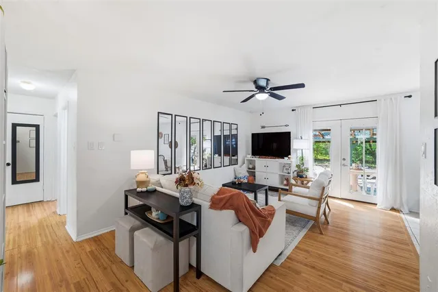 a living room with furniture fireplace and a flat screen tv