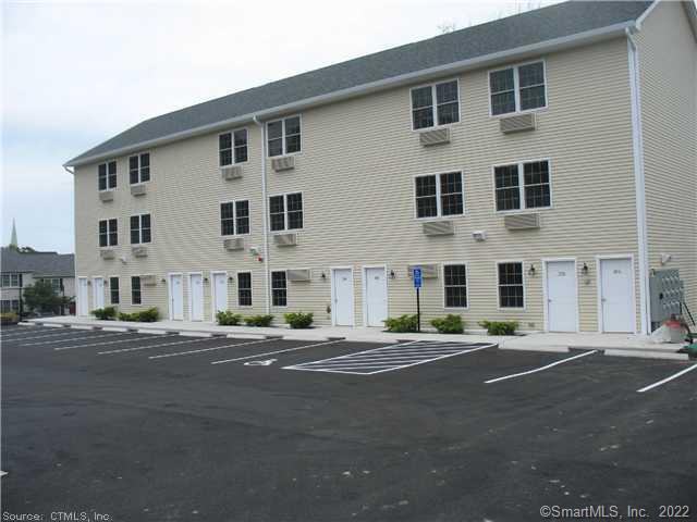 41 Grand Street, Unit 101 Danbury, CT 06810 - Photo 13 of 14 a front view of building with road