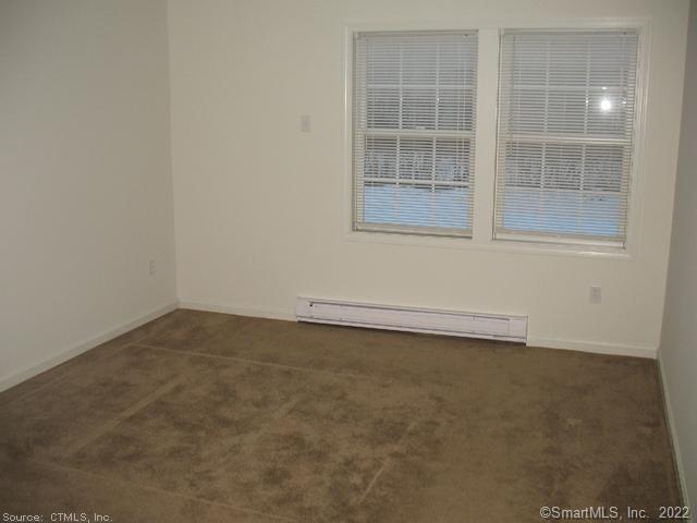 41 Grand Street, Unit 101 Danbury, CT 06810 - Photo 6 of 14 an empty room with a window