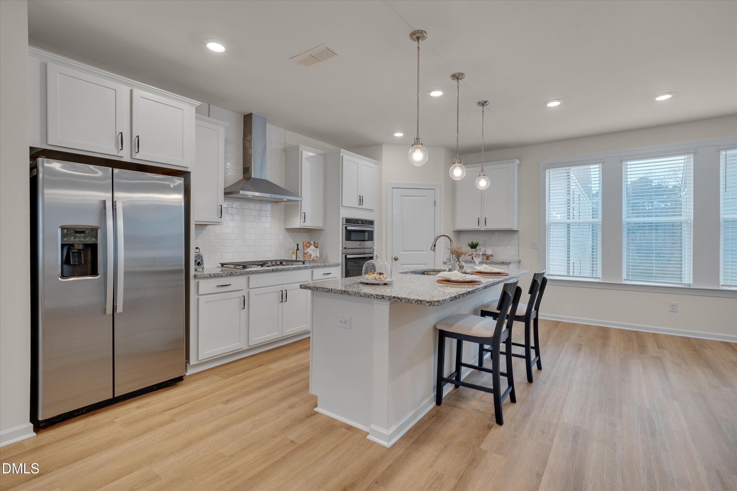 7009 Gentle Pine Place Raleigh, NC 27613 - Photo 8 of 23 Open Kitchen & Dining