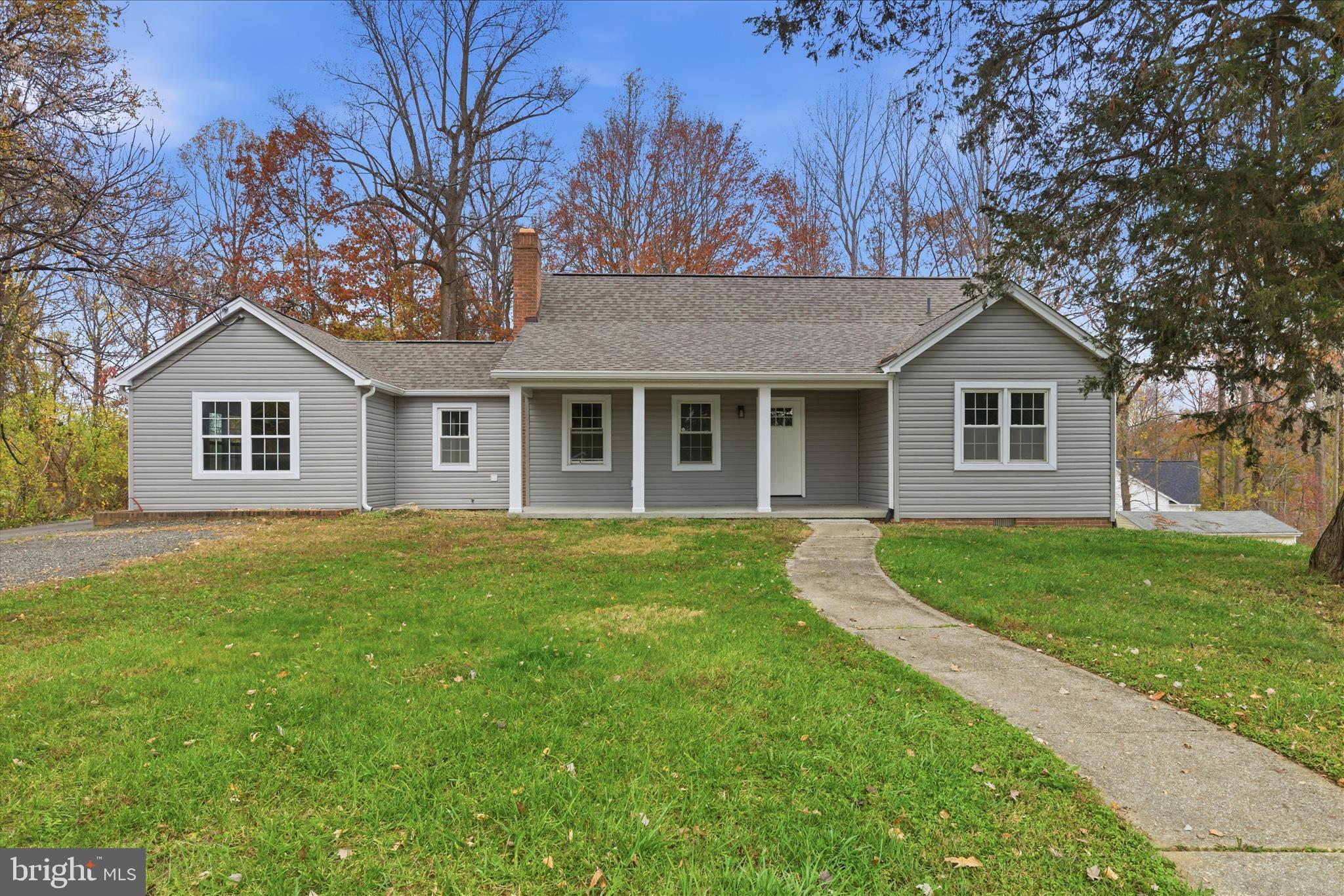 130 Cox Road Huntingtown, MD 20639 - Photo 1 of 41 a front view of a house with a garden
