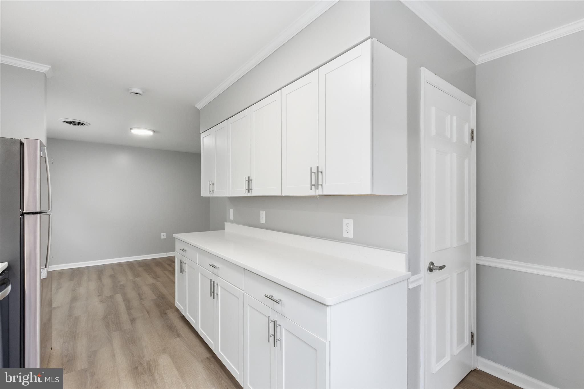 130 Cox Road Huntingtown, MD 20639 - Photo 12 of 41 a kitchen with a sink a cabinets and a window