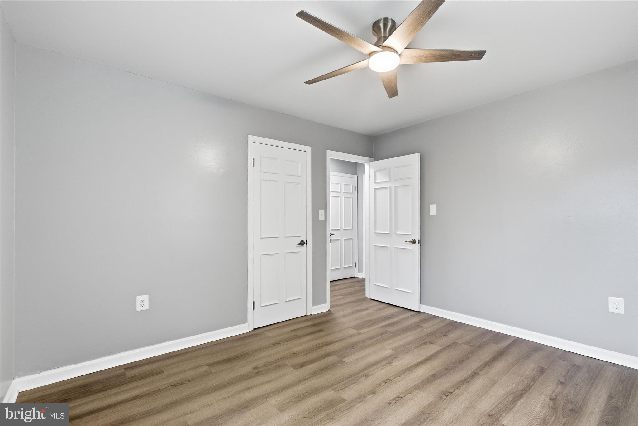130 Cox Road Huntingtown, MD 20639 - Photo 23 of 41 a view of a room with wooden floor and a ceiling fan