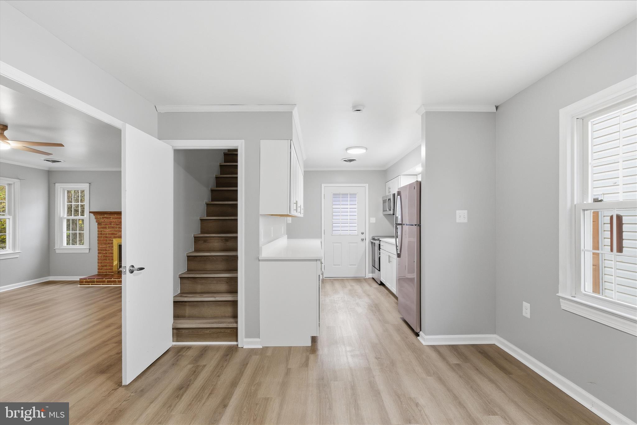130 Cox Road Huntingtown, MD 20639 - Photo 28 of 41 a view of a hallway with wooden floor and stairs