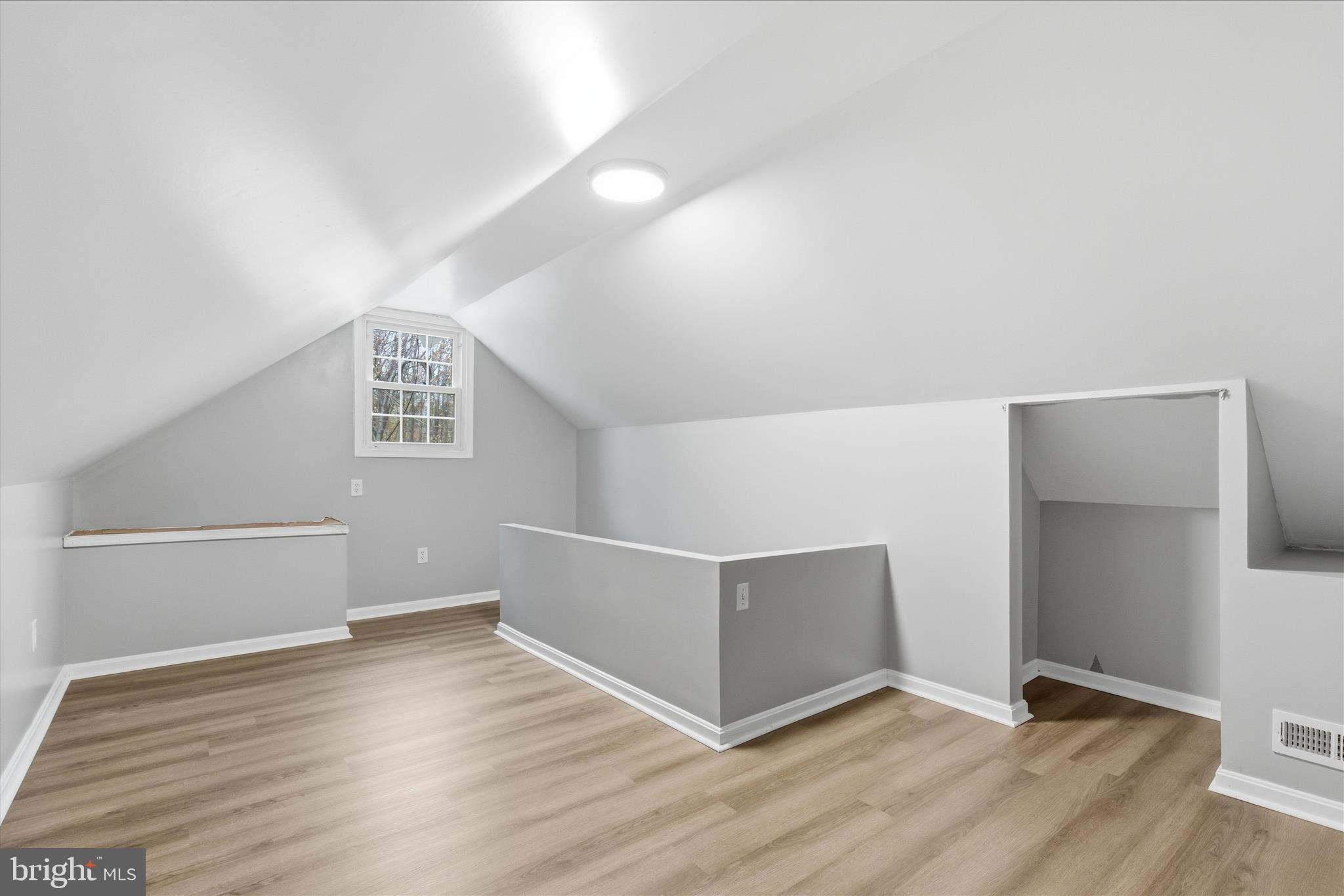 130 Cox Road Huntingtown, MD 20639 - Photo 30 of 41 a view of an empty room with wooden floor and a window