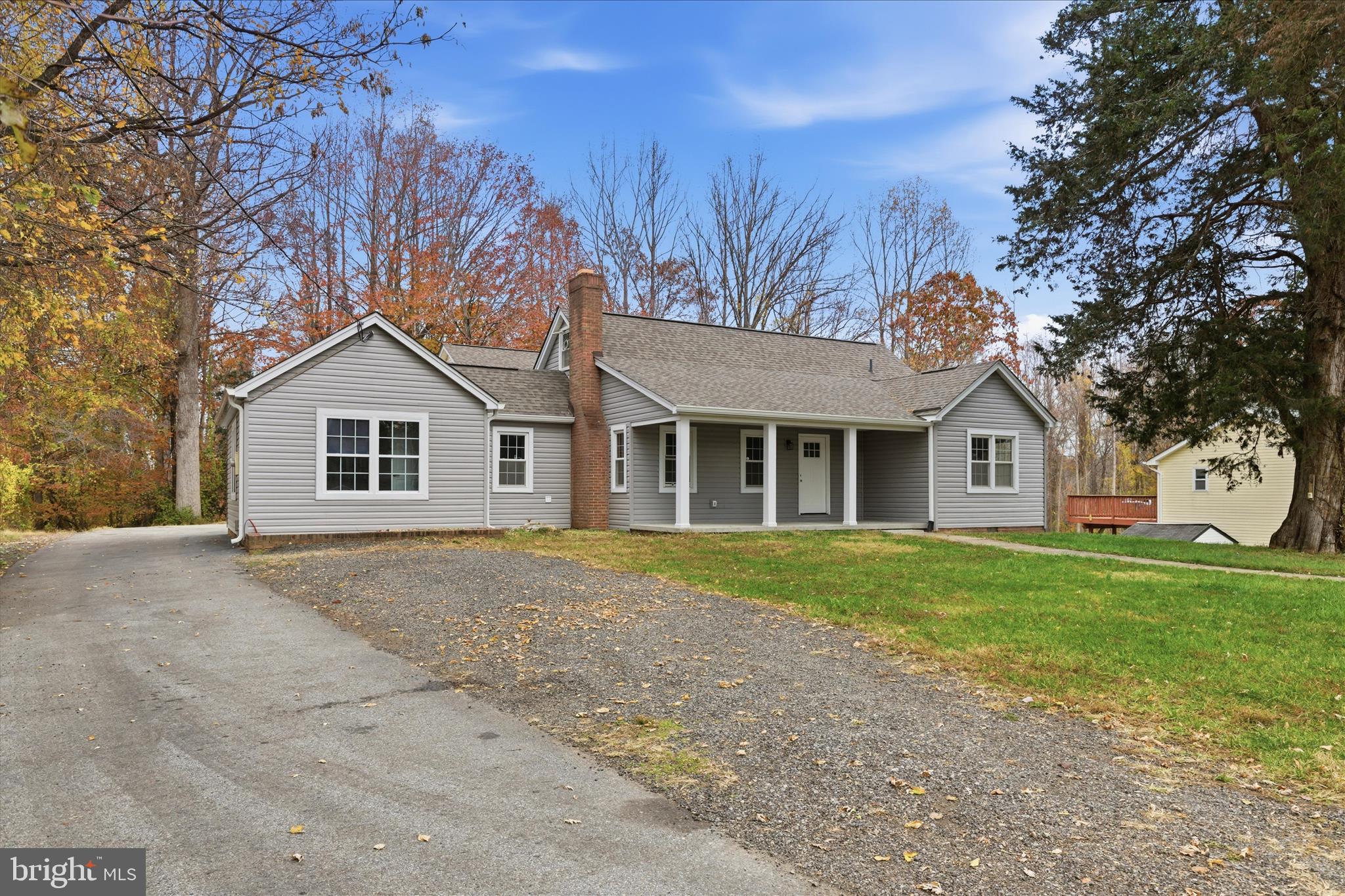 130 Cox Road Huntingtown, MD 20639 - Photo 38 of 41 a front view of a house with a garden and trees