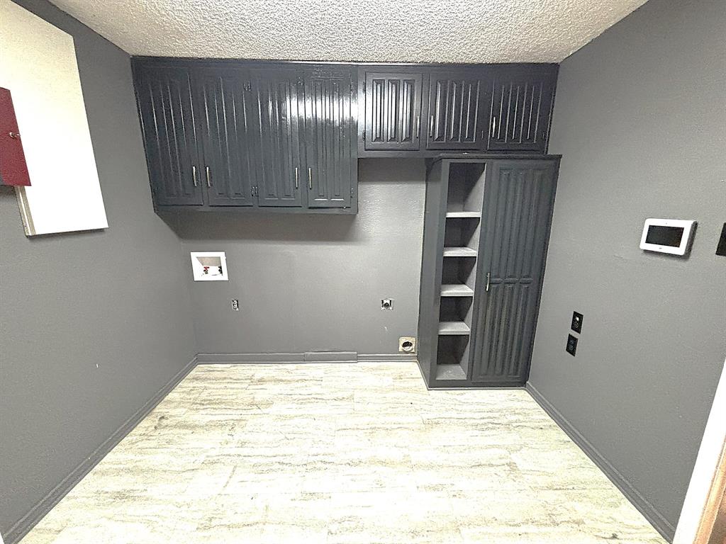 3042 Kiest Ridge Drive Dallas, TX 75233 - Photo 16 of 27 a view of a livingroom with an empty space and wooden floor