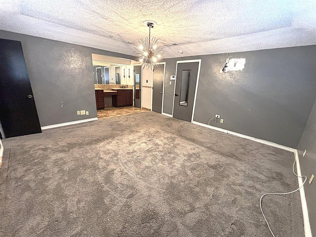 3042 Kiest Ridge Drive Dallas, TX 75233 - Photo 18 of 27 a view of a livingroom with a chandelier