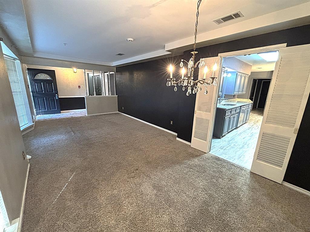 3042 Kiest Ridge Drive Dallas, TX 75233 - Photo 10 of 27 a view of a hallway with windows