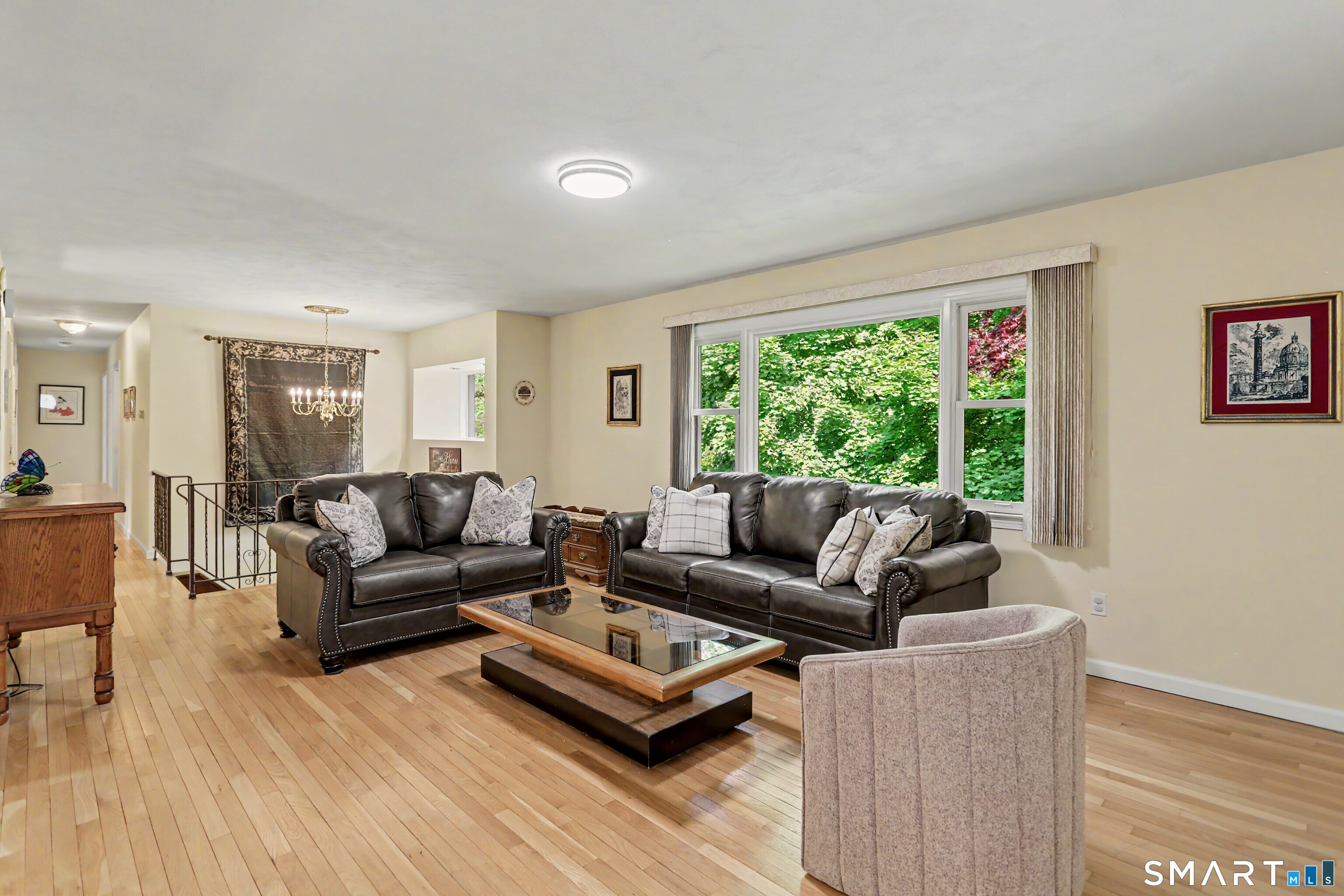 632 Wheelers Farm Road Orange, CT 06477 - Photo 5 of 39 a living room with furniture and a large window