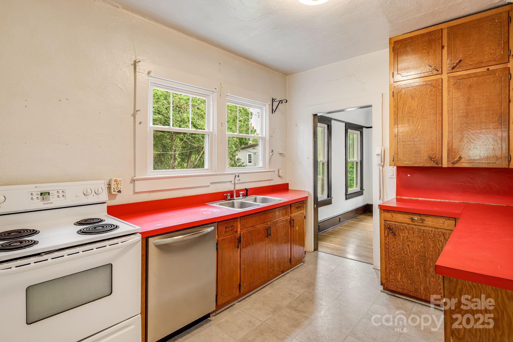 206 Rhododendron Drive Brevard, NC 28712 - Photo 16 of 36 a kitchen with a stove and a microwave