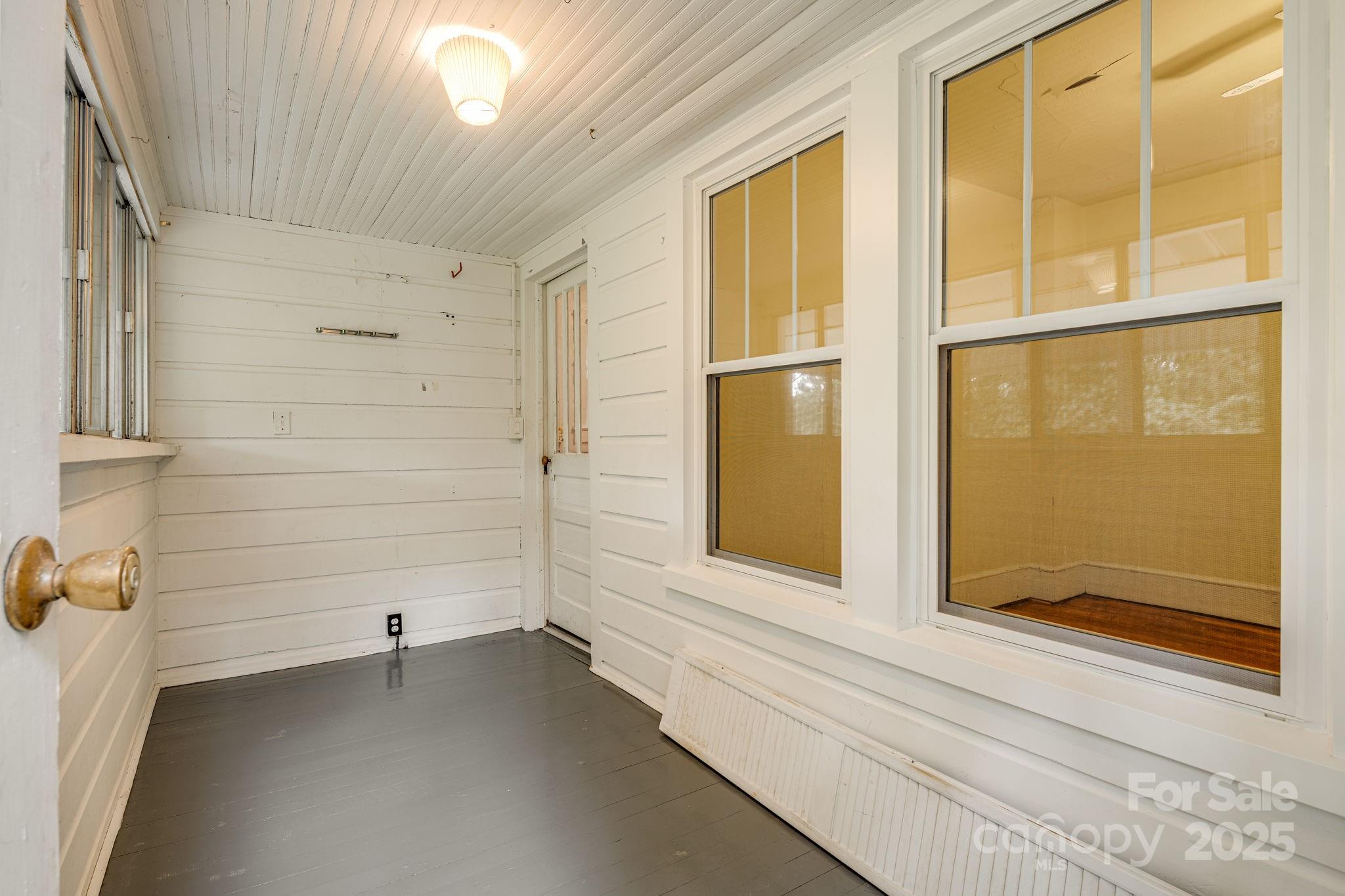 206 Rhododendron Drive Brevard, NC 28712 - Photo 20 of 36 a view of an empty room with a window