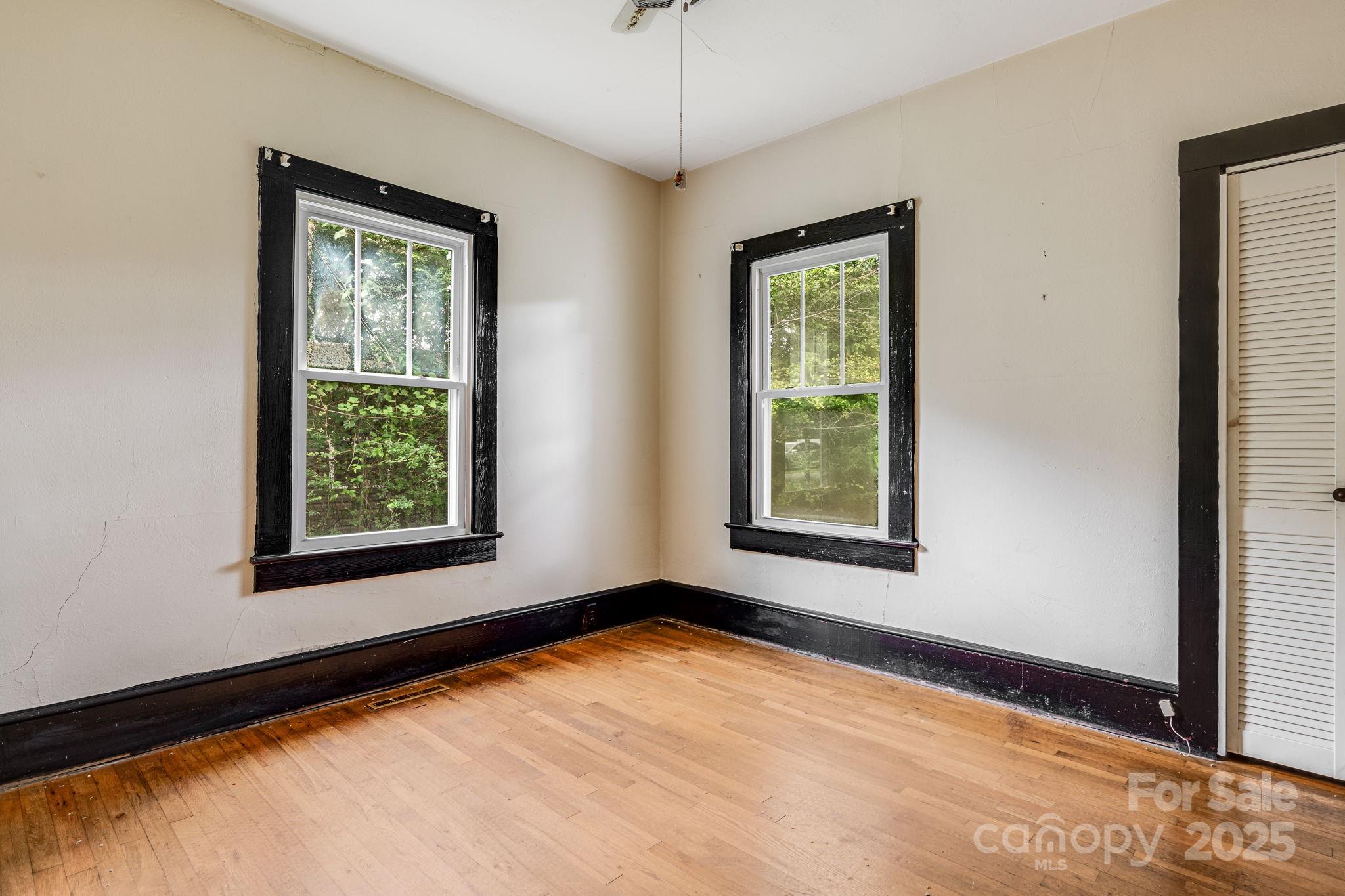 206 Rhododendron Drive Brevard, NC 28712 - Photo 21 of 36 a view of an empty room with a window